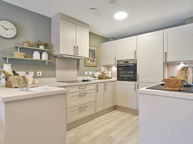 a kitchen with white cabinets