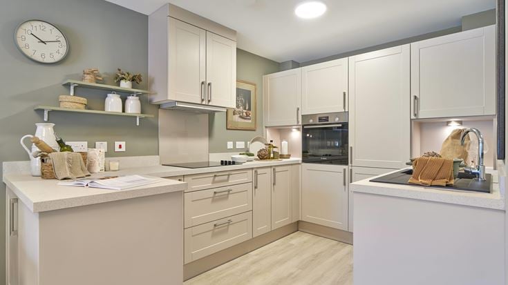 a kitchen with white cabinets