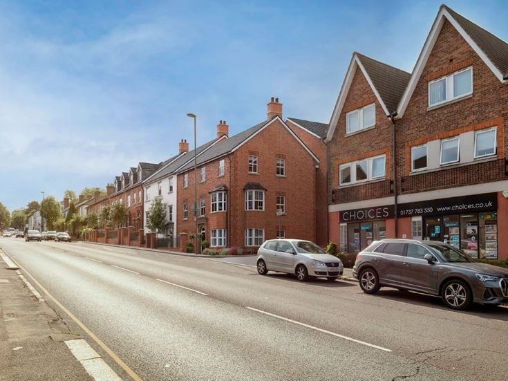 a street with cars parked along it