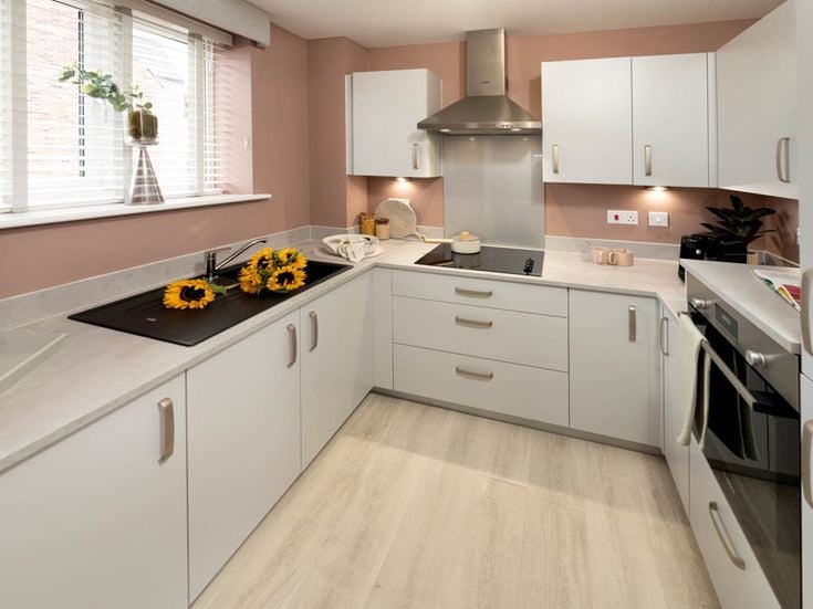 a kitchen with white cabinets