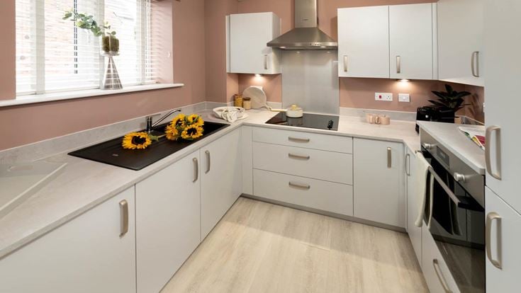 a kitchen with white cabinets