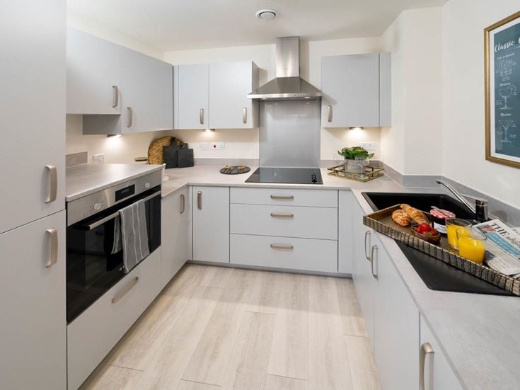 a kitchen with white cabinets