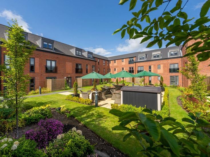 a garden in front of a building