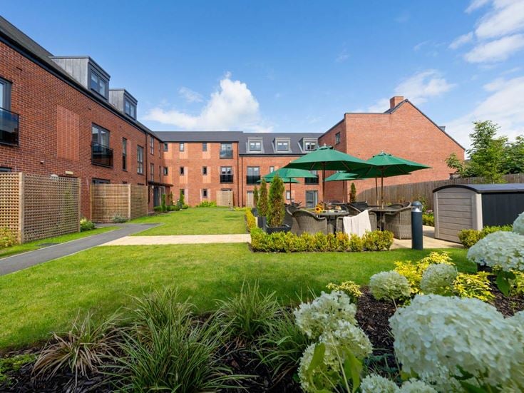a garden in front of a building