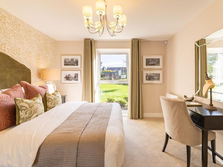a bedroom with a large window