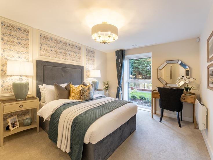 a bedroom with a large mirror
