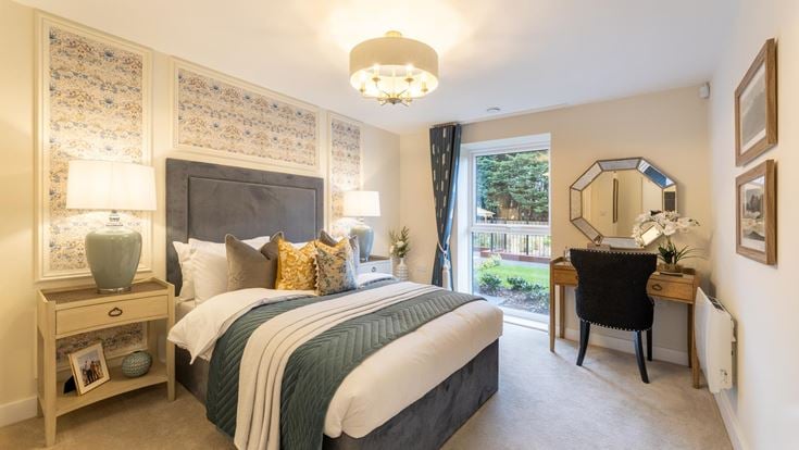 a bedroom with a large mirror