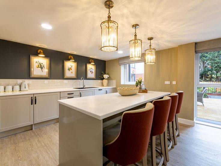 a kitchen with a dining table and chairs
