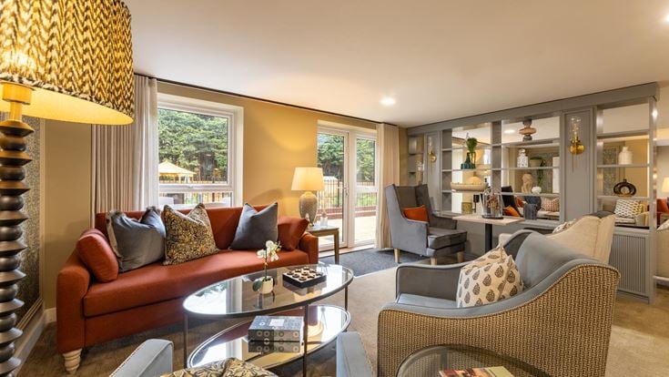 a living room with a large glass door