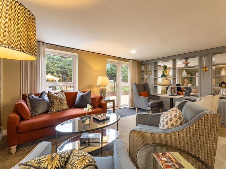 a living room with a large glass door