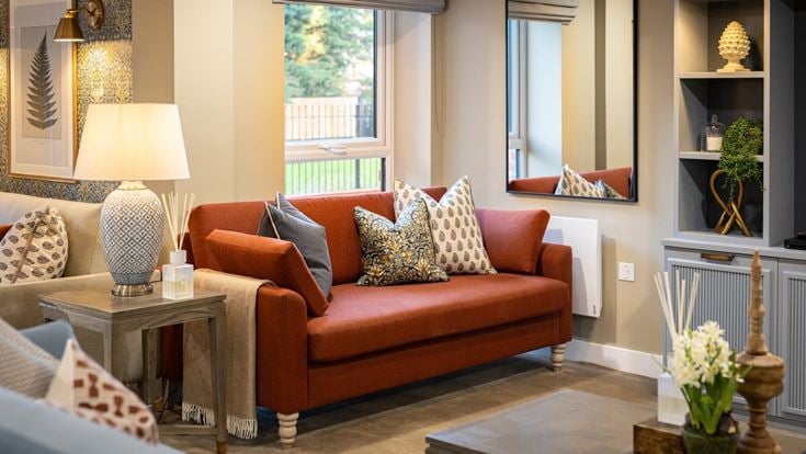 a living room with a red couch