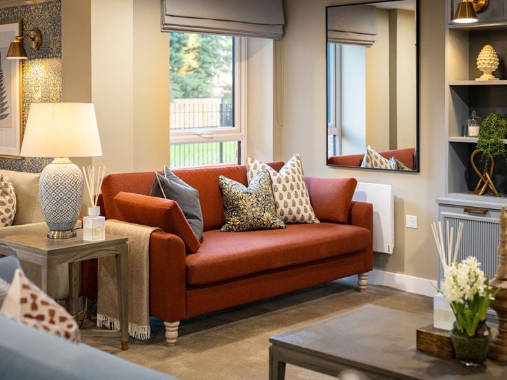 a living room with a red couch