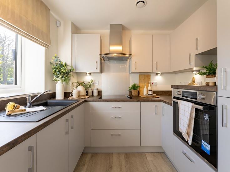 a kitchen with white cabinets