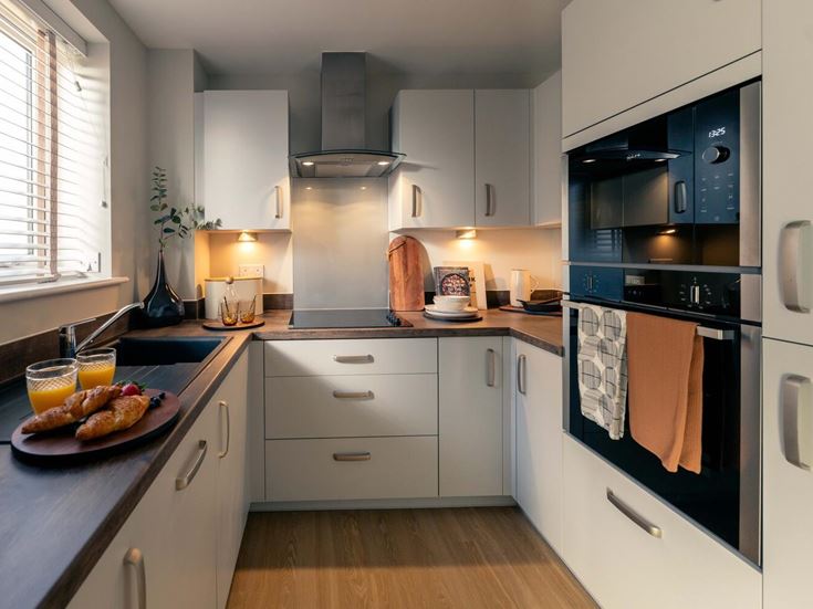 a kitchen with white cabinets