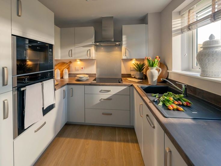 a kitchen with white cabinets