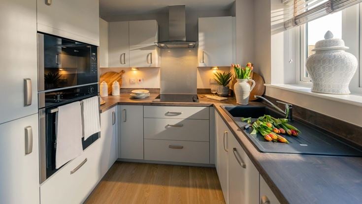 a kitchen with white cabinets
