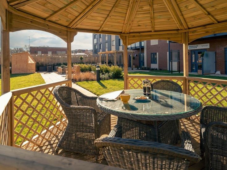 a table and chairs on a deck
