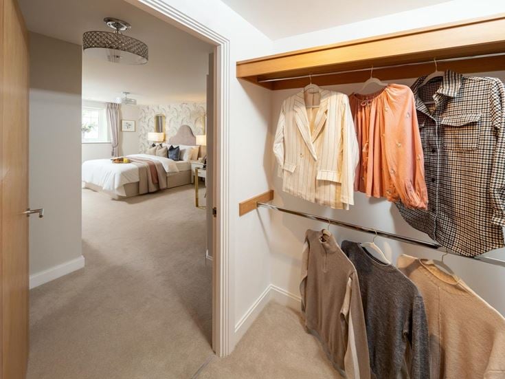 a bedroom with a bed and a mirror