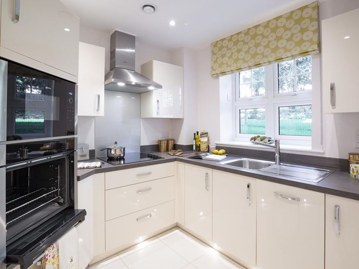 a kitchen with white cabinets