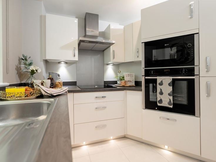 a kitchen with white cabinets