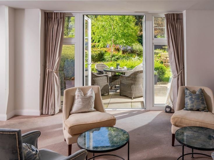 a living room with a large glass door