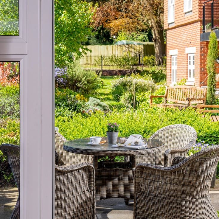 a patio with a table and chairs