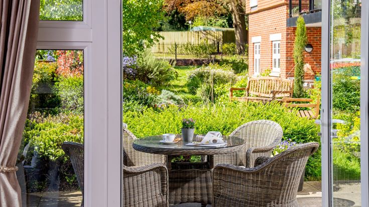 a patio with a table and chairs