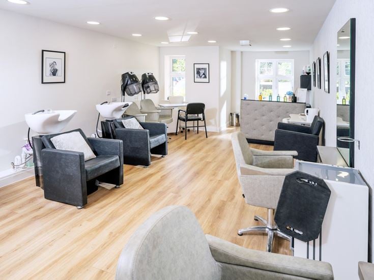 a room with a table chairs and a couch