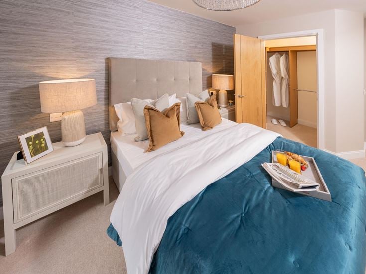 a bed with a book on it