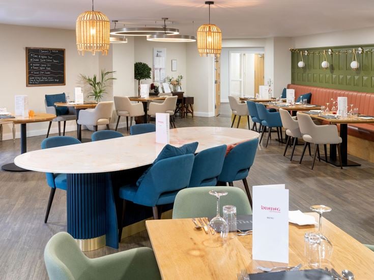 a room with tables and chairs