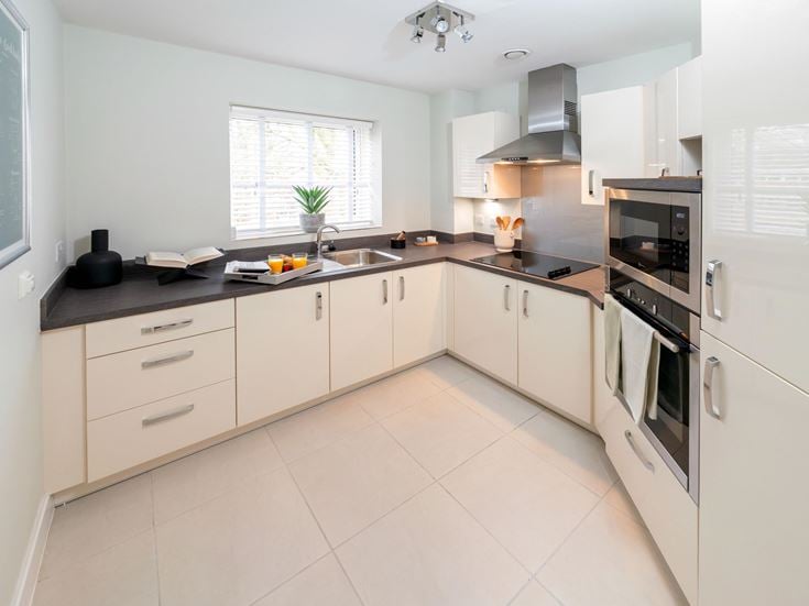 a kitchen with white cabinets