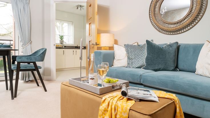 a living room with a blue couch