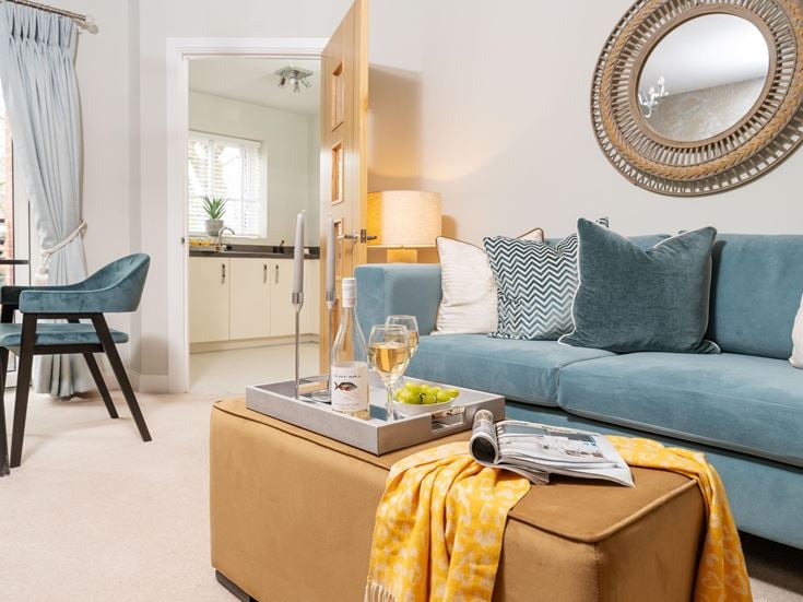a living room with a blue couch