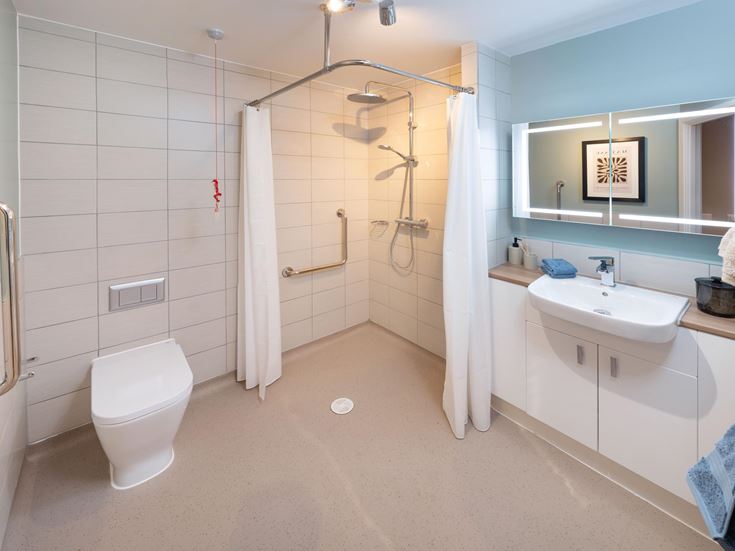 a bathroom with a shower and toilet