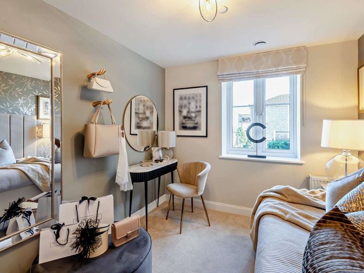a bedroom with a bed and a mirror