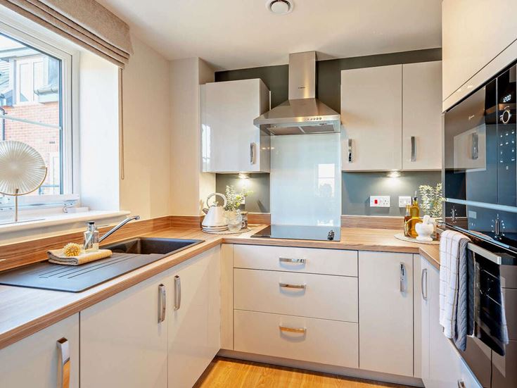 a kitchen with white cabinets