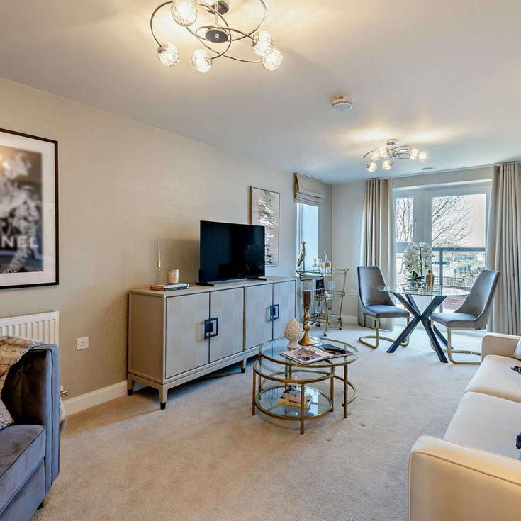 a living room with a tv and couches