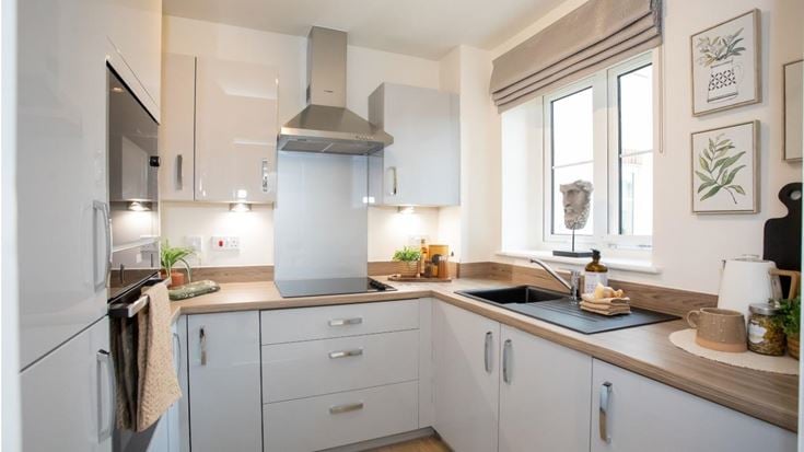 a kitchen with white cabinets