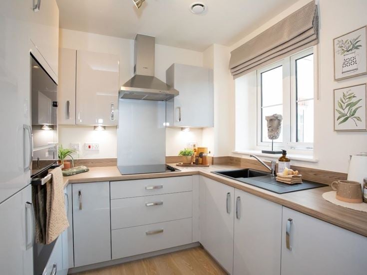 a kitchen with white cabinets