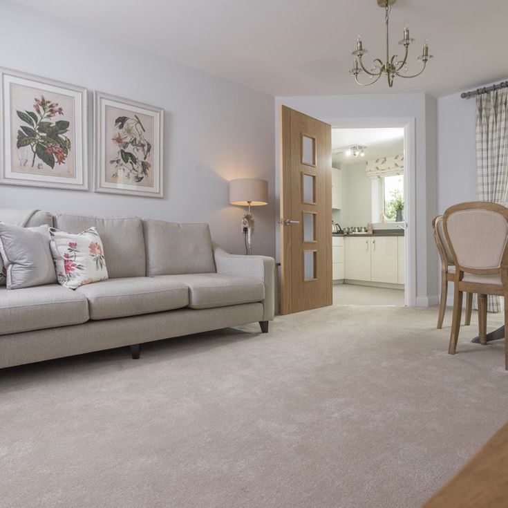 a living room with a couch and a dining table