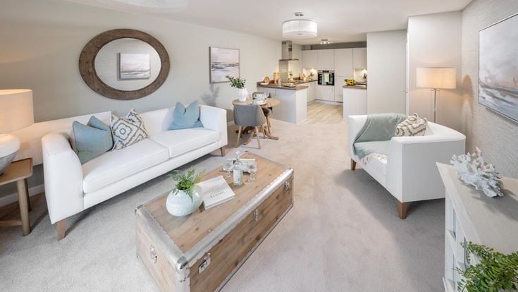 a living room with white couches