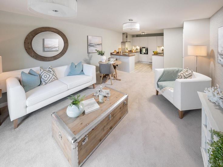 a living room with white couches