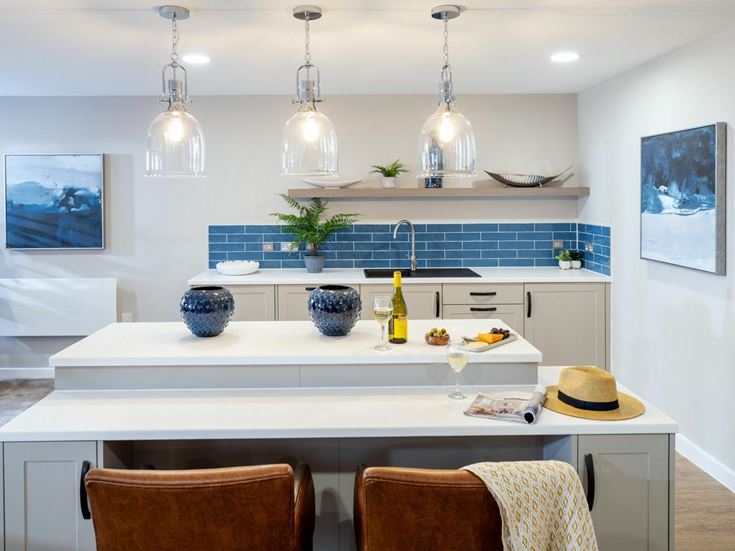 a kitchen with a white countertop and a blue counter top