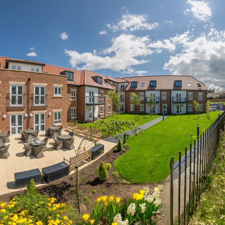 a garden in front of a building