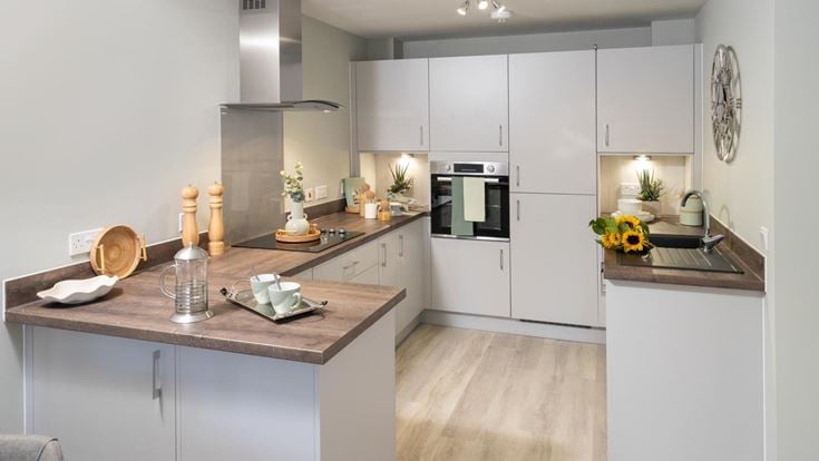 a kitchen with white cabinets