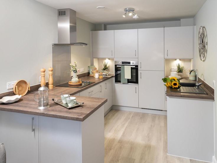 a kitchen with white cabinets