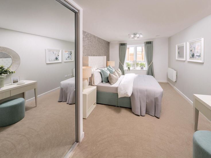 a bedroom with a bed and a couch