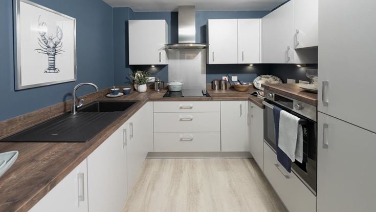 a kitchen with white cabinets