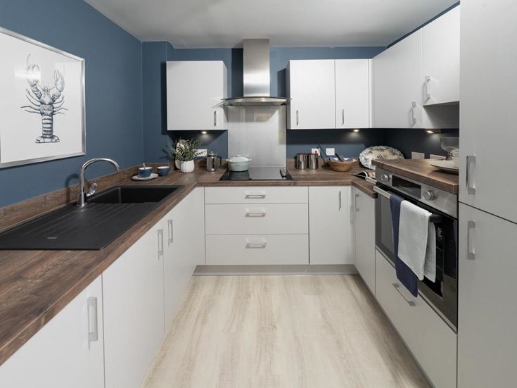a kitchen with white cabinets