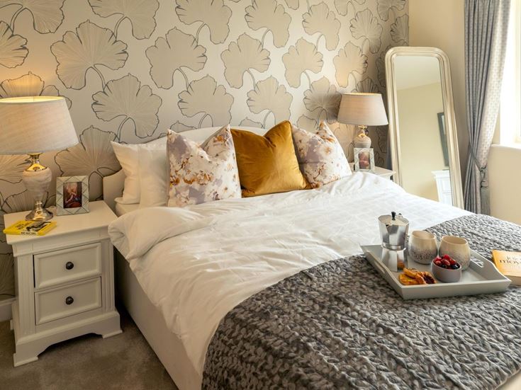 a bed with a white bed spread